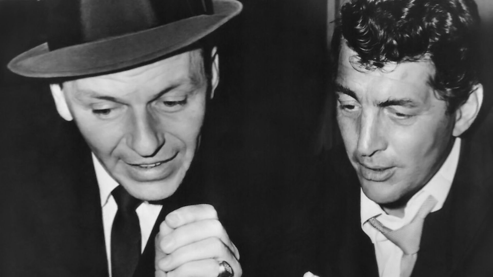 Publicity photo of Frank Sinatra and Dean Martin in a recording studio, distributed ahead of the release of their 1963 film 4 for Texas.