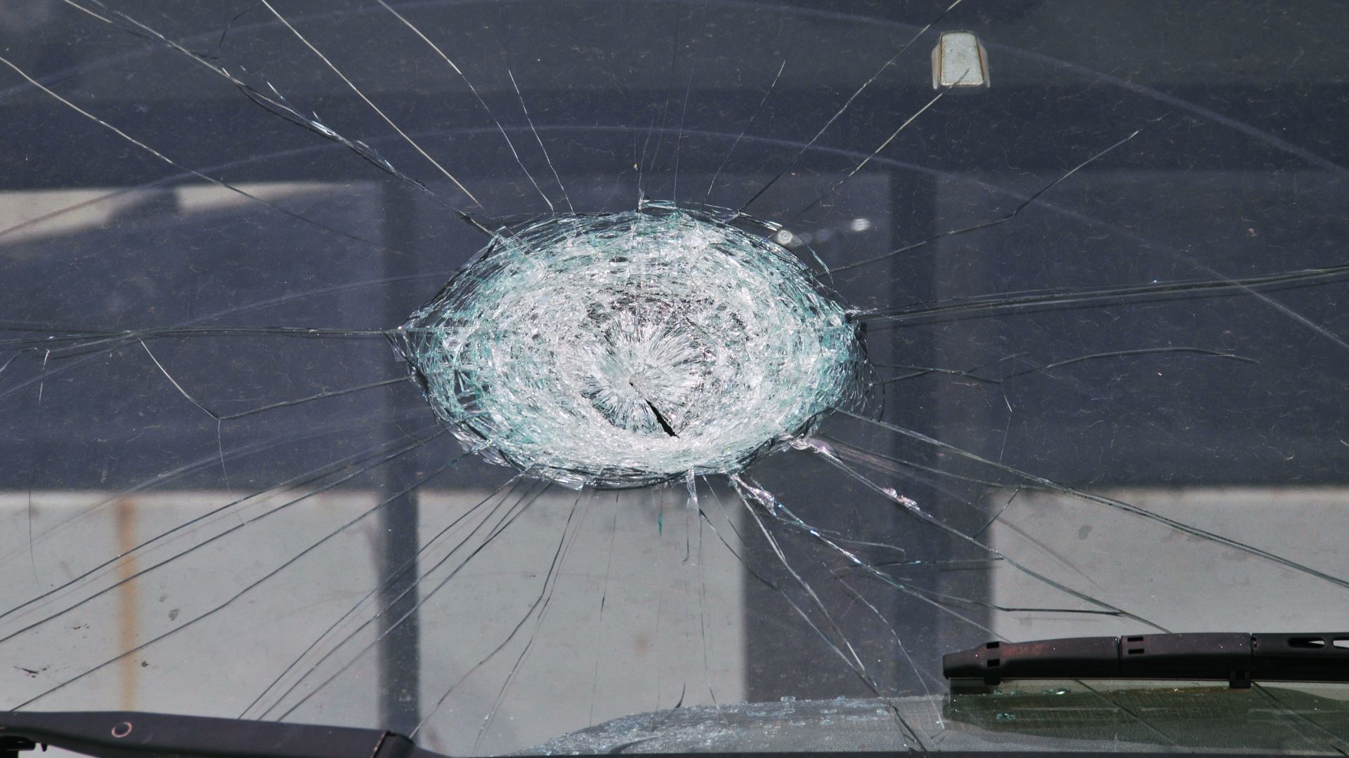 Moore, OK, May 25, 2010 -- The impact of a baseball-sized hail stone is evident on the windshield of a city service vehicle.  City and county municipalities in the eastern half of the state experienced damages and losses to their buildings and other property caused by 22 confirmed tornadoes on May 10.  FEMA Photo by Win Henderson