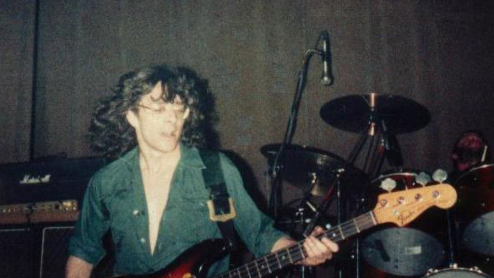 Burke Shelley, of Budgie, performing in 1981. Steve Williams can be seen in the background on drums.