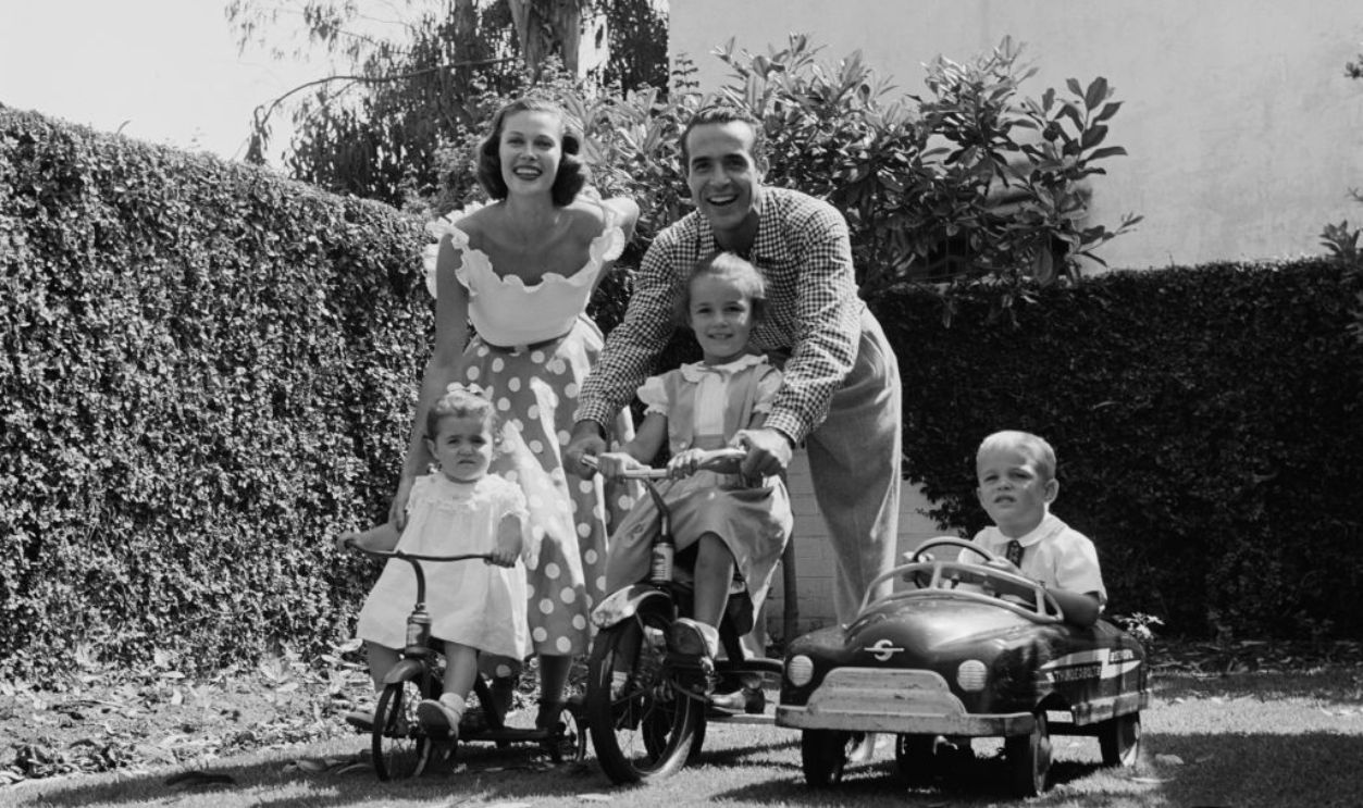 Mexican actor Ricardo Montalban (1920 - 2009) at home with his wife, actress Georgiana Young (1924 - 2007) and their children, 1951.