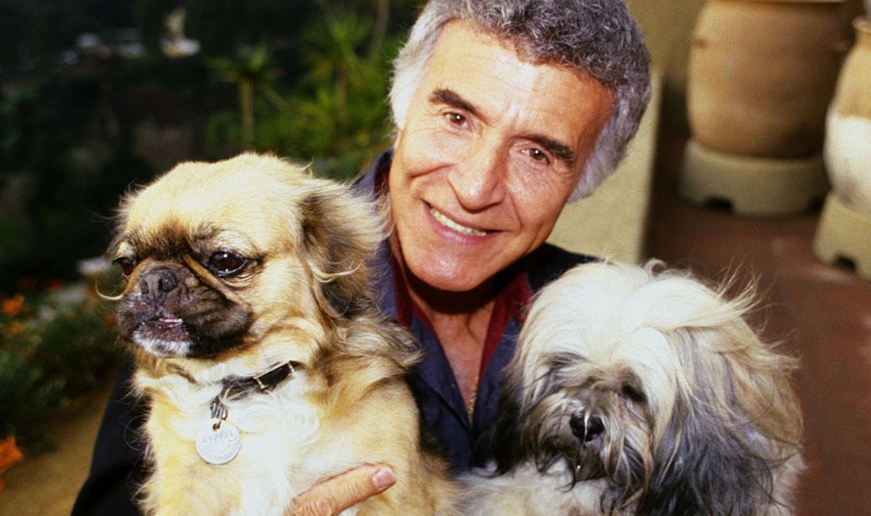 Ricardo Montalban and his pet dogs during At Home Portrait Session With Actor Ricardo Montalban, 1986 at Private Residence in Hollywood Hills, California, United States.