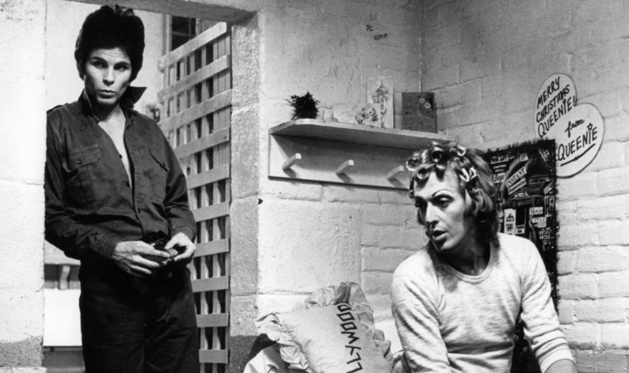 Zooey Hall stands in the doorway and Michael Greer sits on his bunk in a scene from the film 'Fortune And Men's Eyes', 1971.