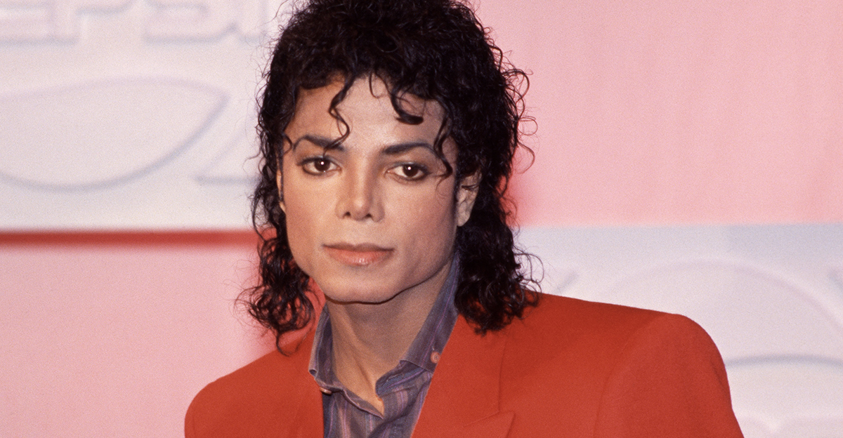 Portrait of Michael Jackson, wearing a red blazer.