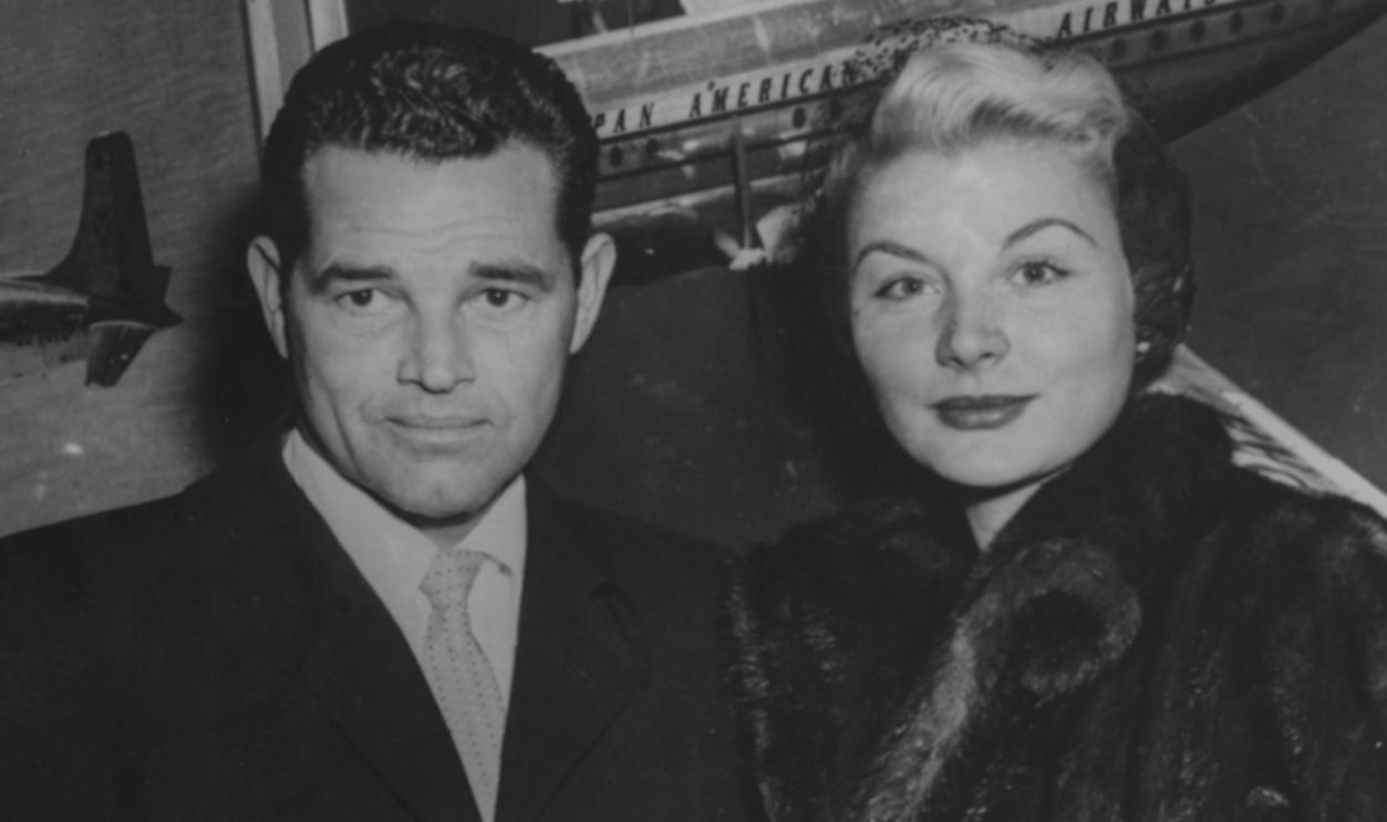 Actors Barbara Payton and Tom Neal pictured on their arrival from England to attend to her son, who is ill with polio, in America, January 10th 1952.