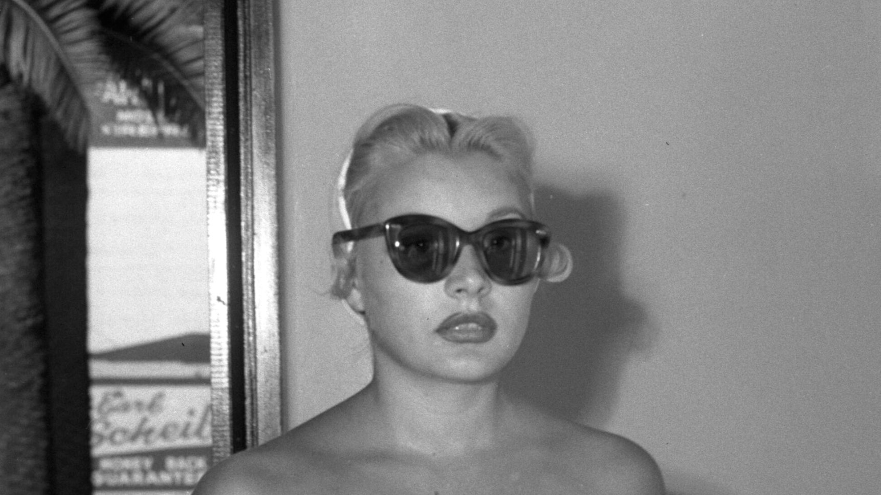 Barbara Payton shown entering California Hospital (by stairway, not fire escape) to see Franchot Tone, injured by Tom Neal in brawl over her.