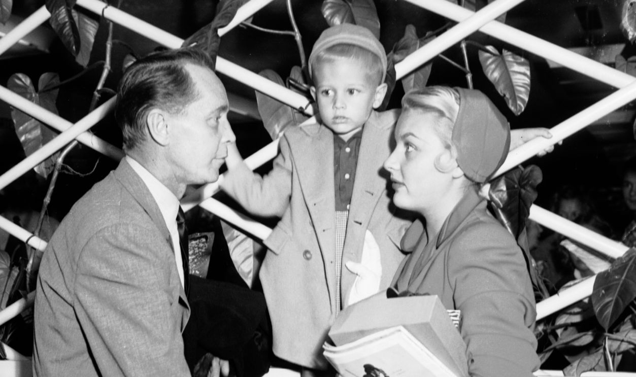 Franchot Tone;Barbara Payton (wife);Johnny -- 4 years (her son by previous marriage);Kent Modglin;June Modglin (friends).;Caption slip reads: 'Photographer: Olmo. Date: 1951-10-02. Reporter: Looman. Assignment: Tone-Payton. Arriving at International Airport: Franchot Tone and his bride, Barbara Payton, with her son by previous marriage, Johnny, 4. In some shots, Tone, Payton and Johnny are shown with Kent Modglin and his wife, June