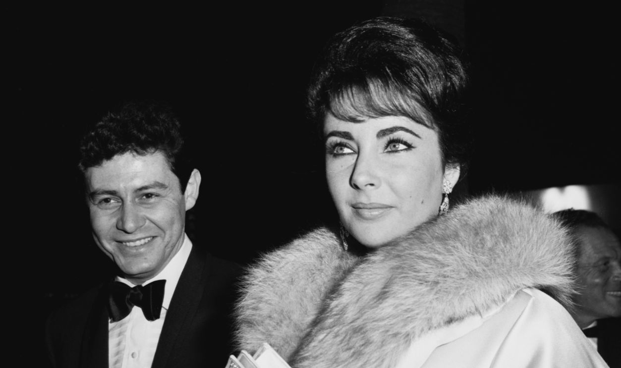 Suddenly, Last Summer Premiere Actress Elizabeth Taylor (1932 - 2011) and her husband, singer and actor Eddie Fisher (1928 - 2010) attend the Hollywood premiere of the film 'Suddenly, Last Summer', Los Angeles, 22nd December 1959. Taylor stars in the fim, which earned her an Academy Award nomination for Best Actress.