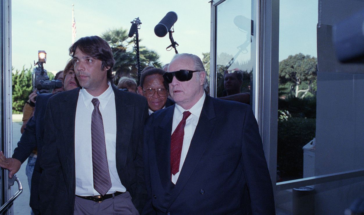Christian Brando and Marlon Brando Walk with Press (Original Caption) 9/26/1990-Santa Monica, California-: Actor Marlon Brando (R), accompanies his son, Christian (L), into Superior Court for a pre-trial hearing