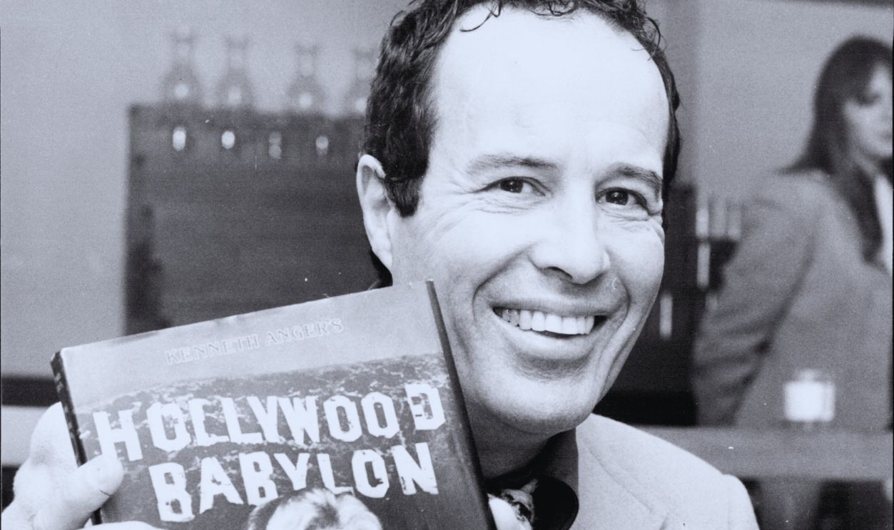 Gettyimages - 1078675048, American film maker and author Kenneth Anger, guest of the Australian Film Theatre pictured at the Paddington Town Hall today, with his book Hollywood Babylon, with a photograph of Jane Mansfield on the cover. 