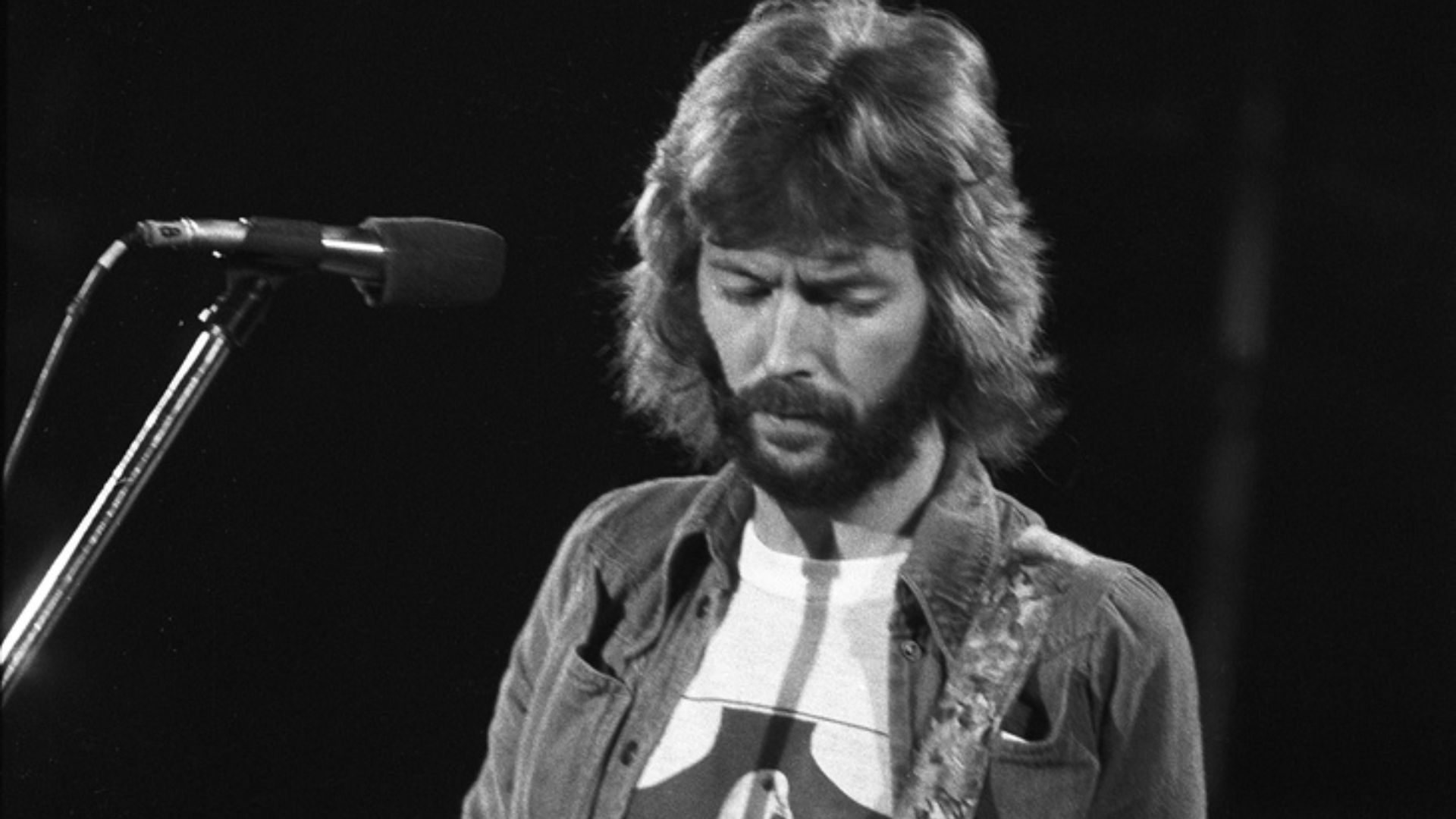 Eric Clapton - Swing Auditorium, San Bernardino, CA, There's One In Every Crowd Tour.
Aug. 15, 1975, Monochrome Frame 17.
Reduction of Tri-X Negative scan at 4000dpi. Shot with an Asahi Pentax w/200mm telephoto.

He's playing Blackie.
