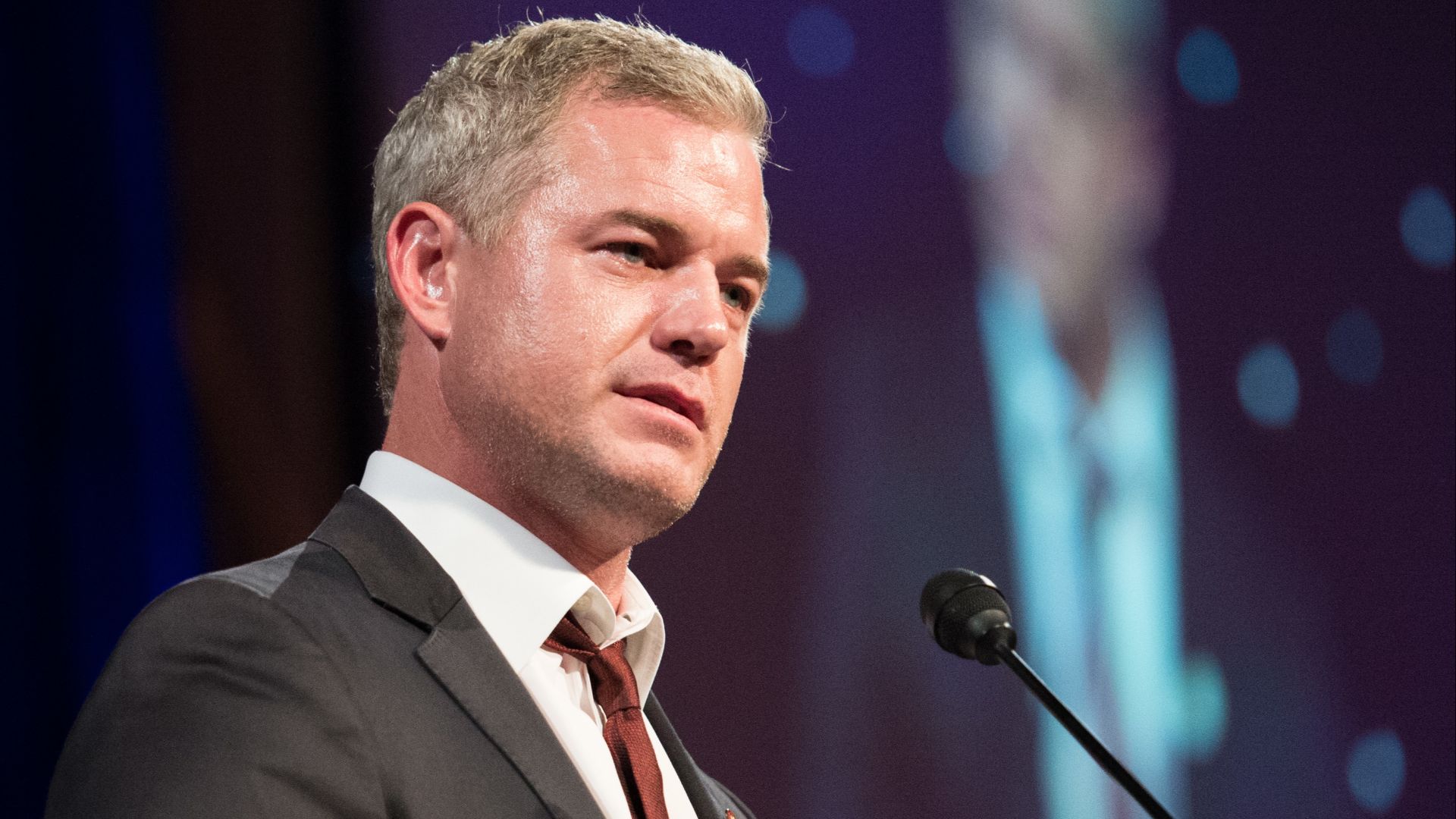 Actor Eric Dane introduces Vice Chief of Naval Operations Adm. Michelle Howard on stage to accept an award on behalf of Chief of Naval Operations Adm. Jonathan Greenert during the 21st Anniversary Tragedy Assistance Program for Survivors Honor Guard Gala 
