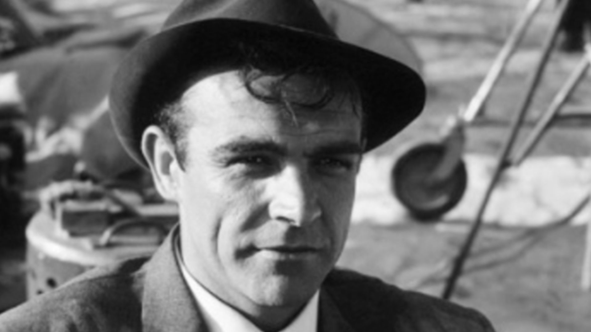 Behind the scenes photo of actor Sean Connery waiting for filming