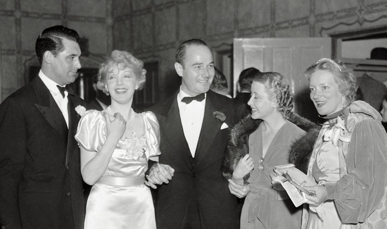 Cary Grant, Ina Claire, William Haines, Genevieve Tobin & Poggy Wood backstage at a LA theater after her recent opening there. Miss Claire is seen to follow this stage.