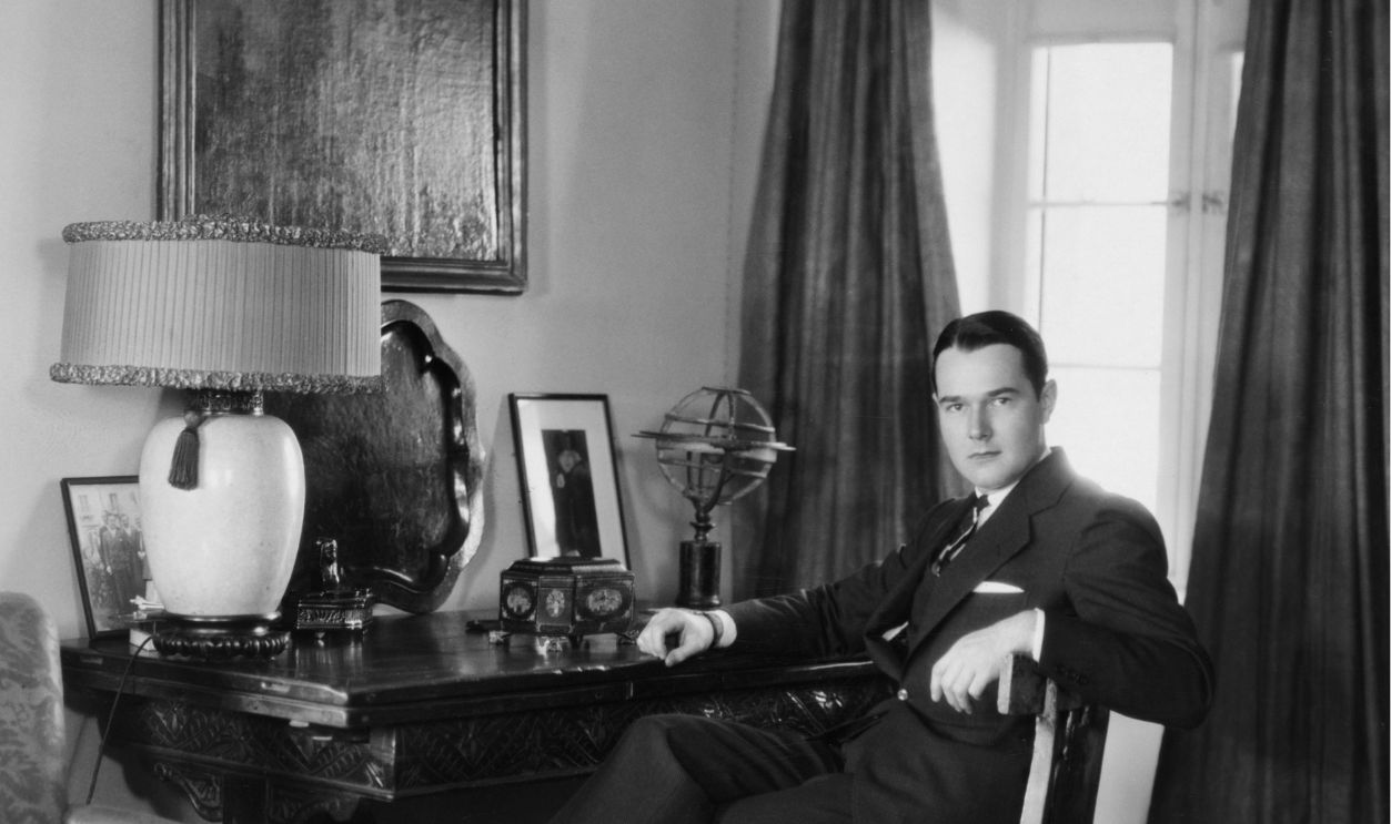 American actor and interior designer William Haines (1900 - 1973) in the study at his home, circa 1928.