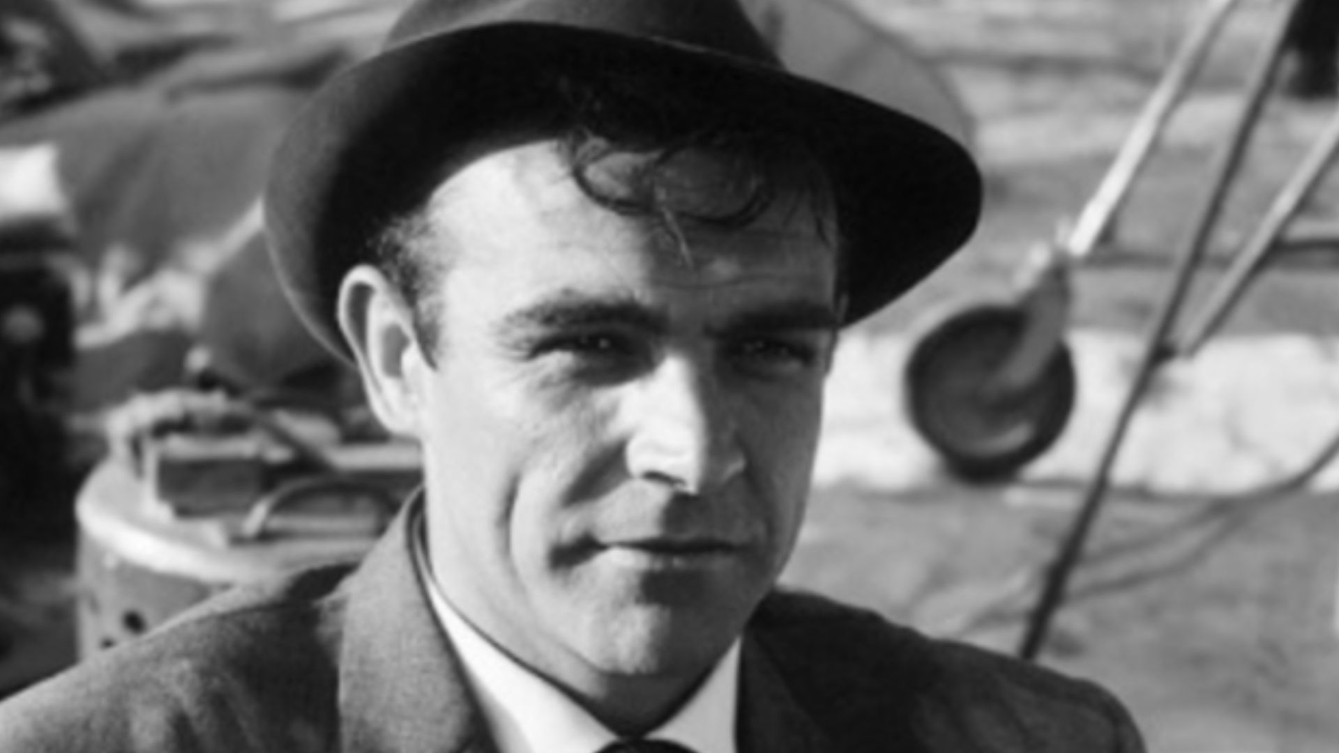 Behind the scenes photo of actor Sean Connery waiting for filming