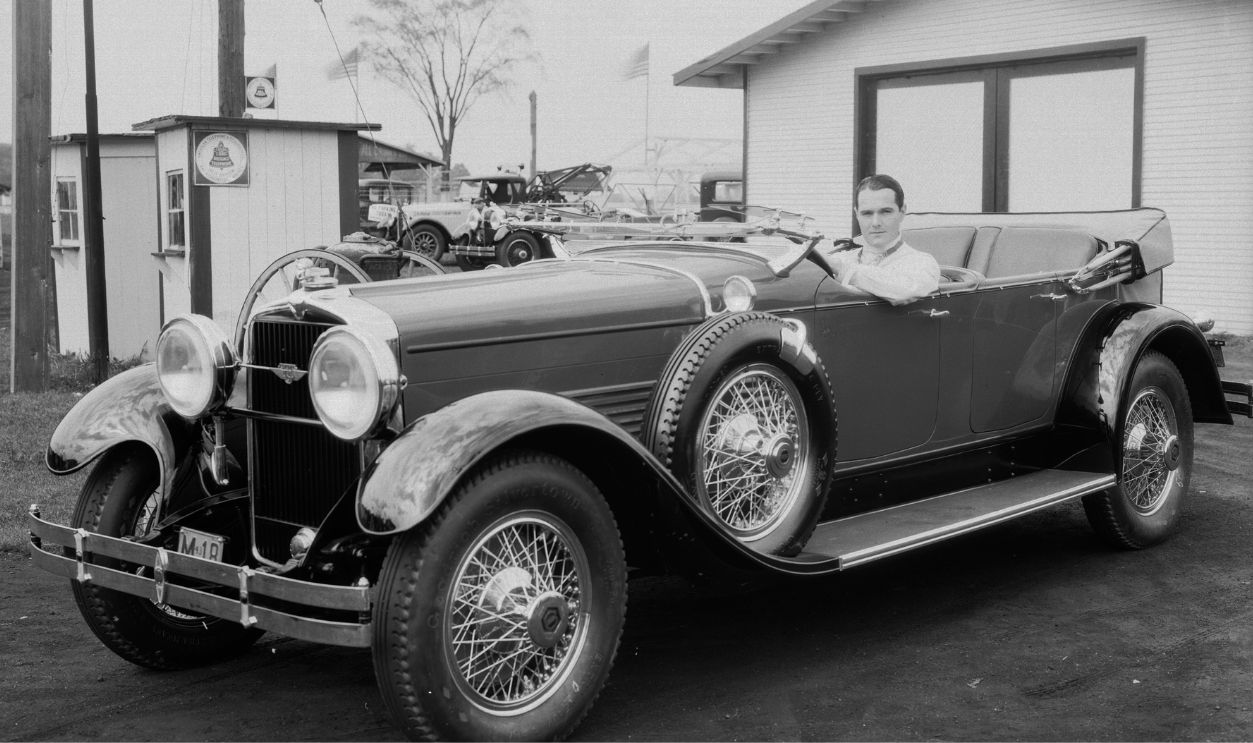circa 1935: Popular American leading man of the silent era William Haines (1900-1973) in his luxury convertible. 