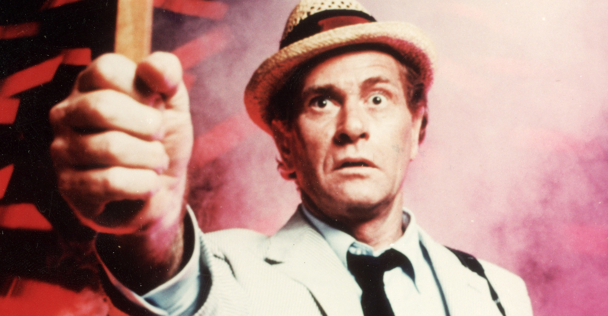 American actor Darren McGavin holds up a crucifix in a still from the television series, 'Kolchak: The Night Stalker,' c. 1974. 