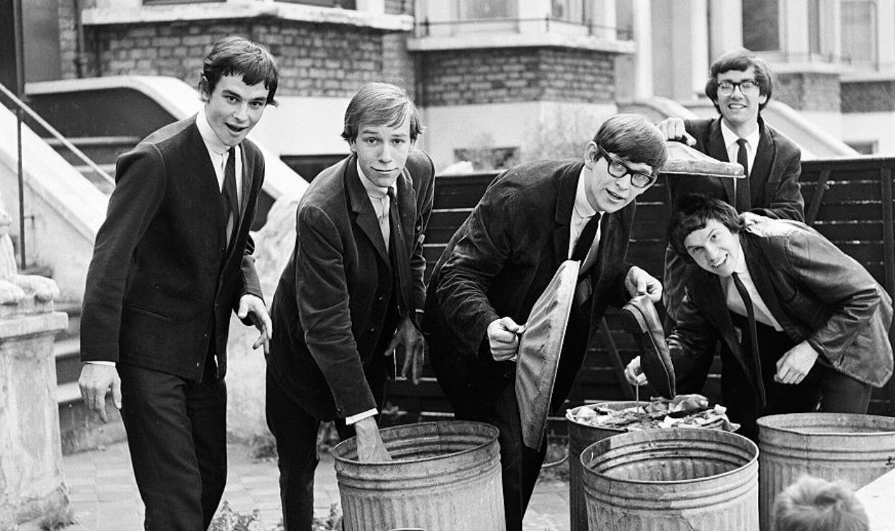 Group portrait of The Zombies going througth dustbins in West London, 1965. L-R Colin Blunstone, Hugh Grundy, Paul Atkinson, Chris White, Rod Argent.