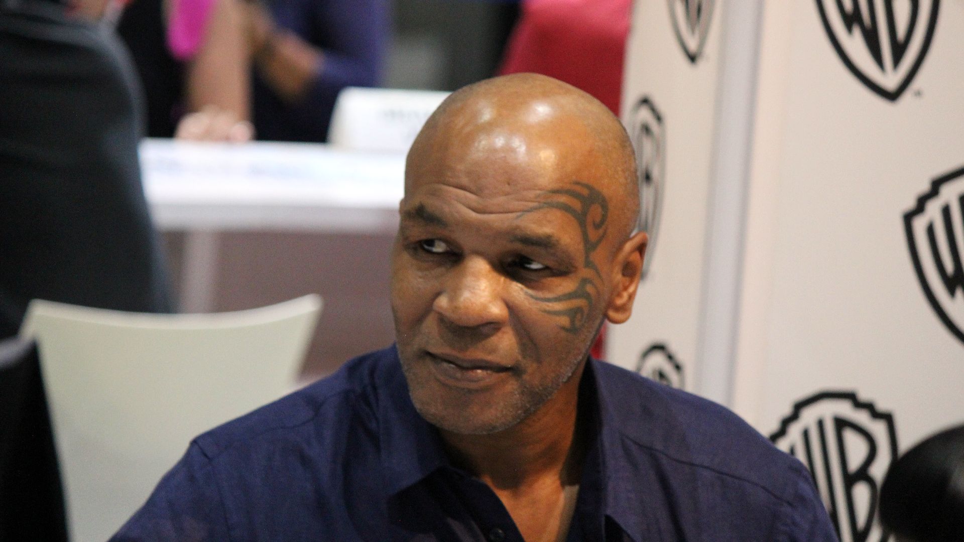 Mike Tyson signing autographs while promoting Mike Tyson Mysteries during the 2017 Comic-Con International at the San Diego Convention Center.