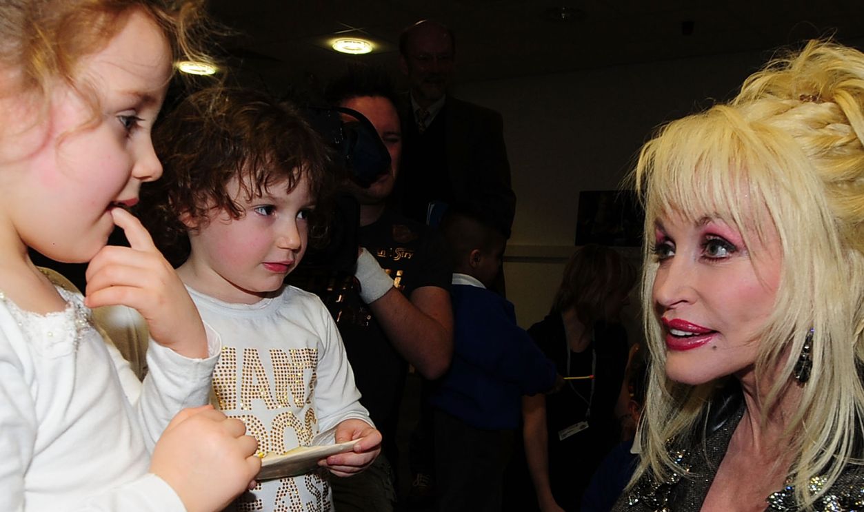  Country and western superstar singer Dolly Parton meets young children at the Magna Science And Adventure Park on December 5, 2007 in Rotherham, South Yorkshire, England. Dolly Parton honoured the former steelworks town to be the first European location to participate in her 'Imagination Library' literacy scheme. The charitable programme, which she launched in her hometown of Sevierville, Tennessee in 1996, encourages young children to discover the joys of reading, with every participating pre-school age child being sent a free book every month. 