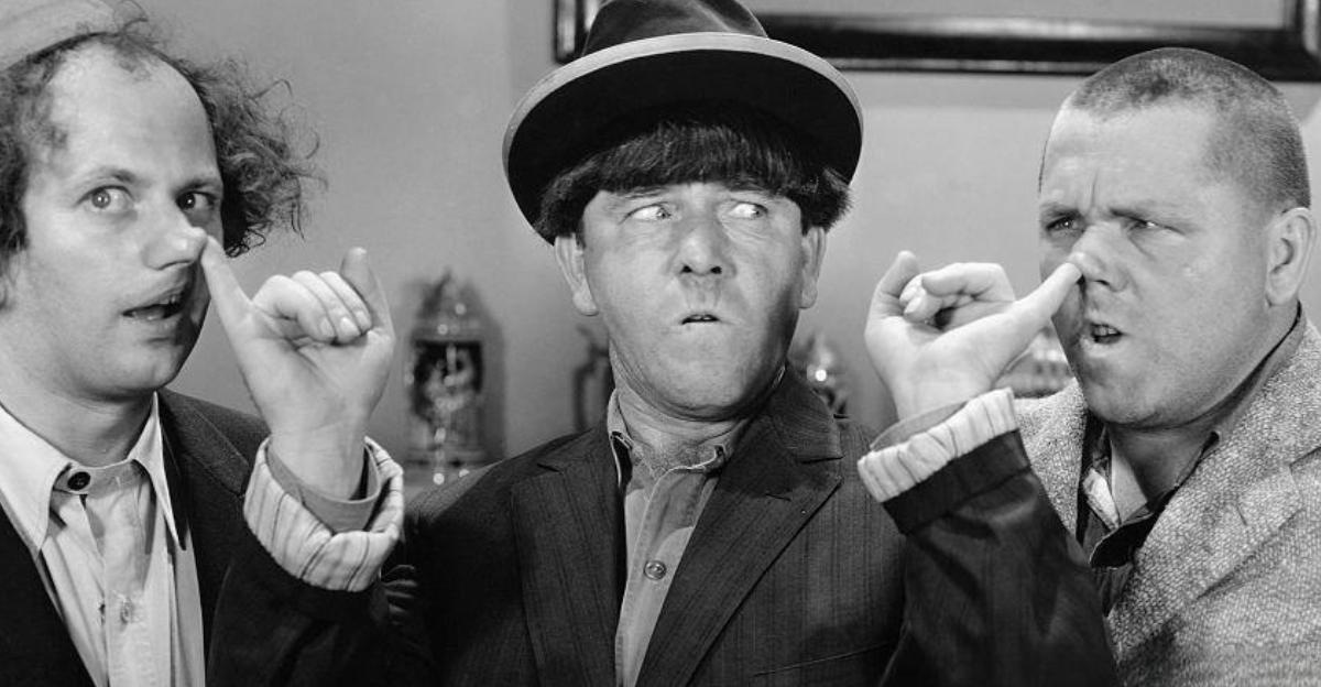 Moe takes control of the situation by placing his fingers in the nostrils of Larry and Curly