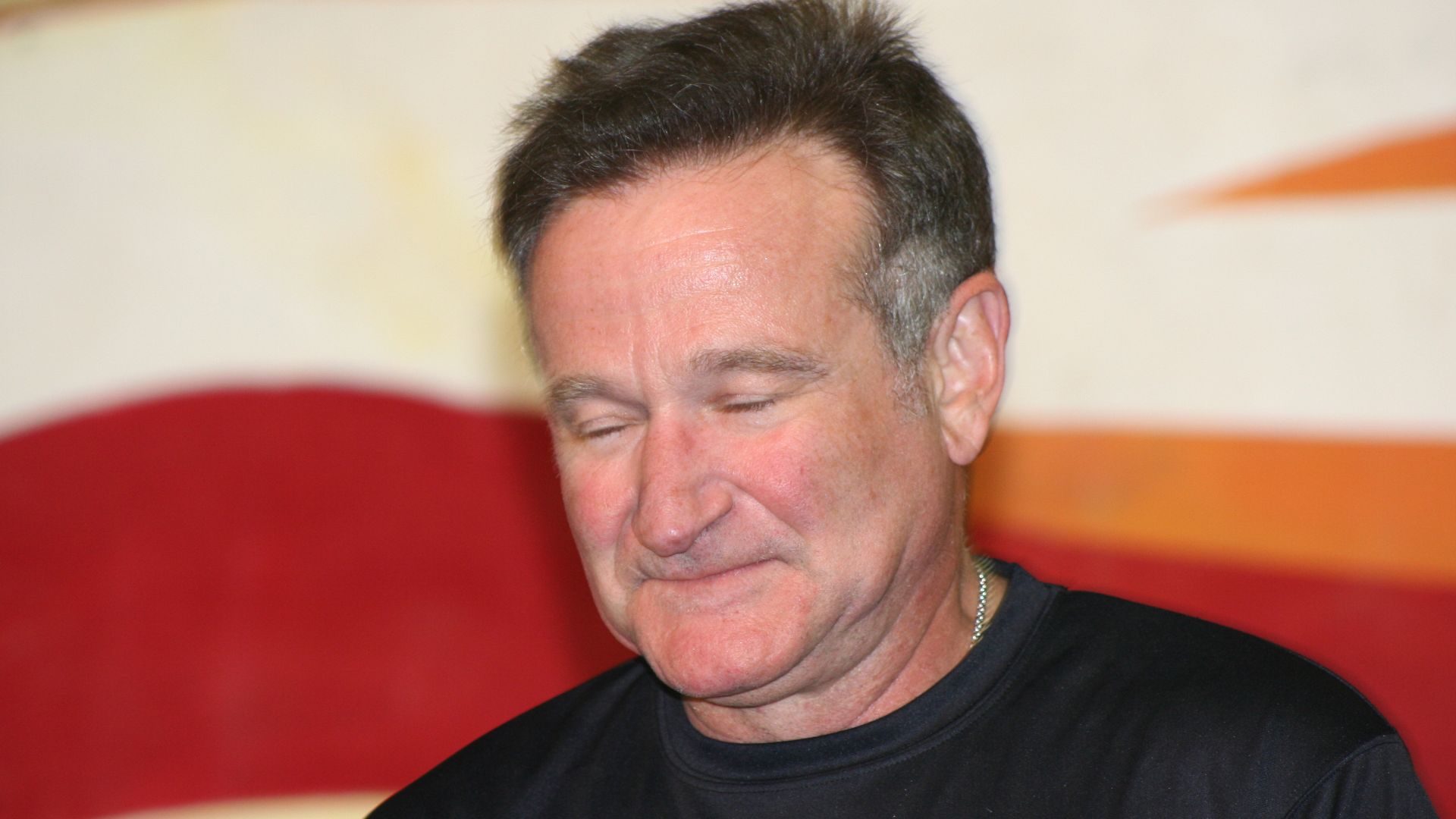 Robin Williams, Academy Award winning actor and comedian, takes a pause from the laughter and antics as he performs on stage at the Contingency Operating Base Speicher. Williams performed for troops at Speicher during a brief USO stopover at the base, Dec. 19. Williams was among several celebrities participating in the tour, to include Rachel Smith, Lance Armstrong, Lewis Black and Kid Rock.