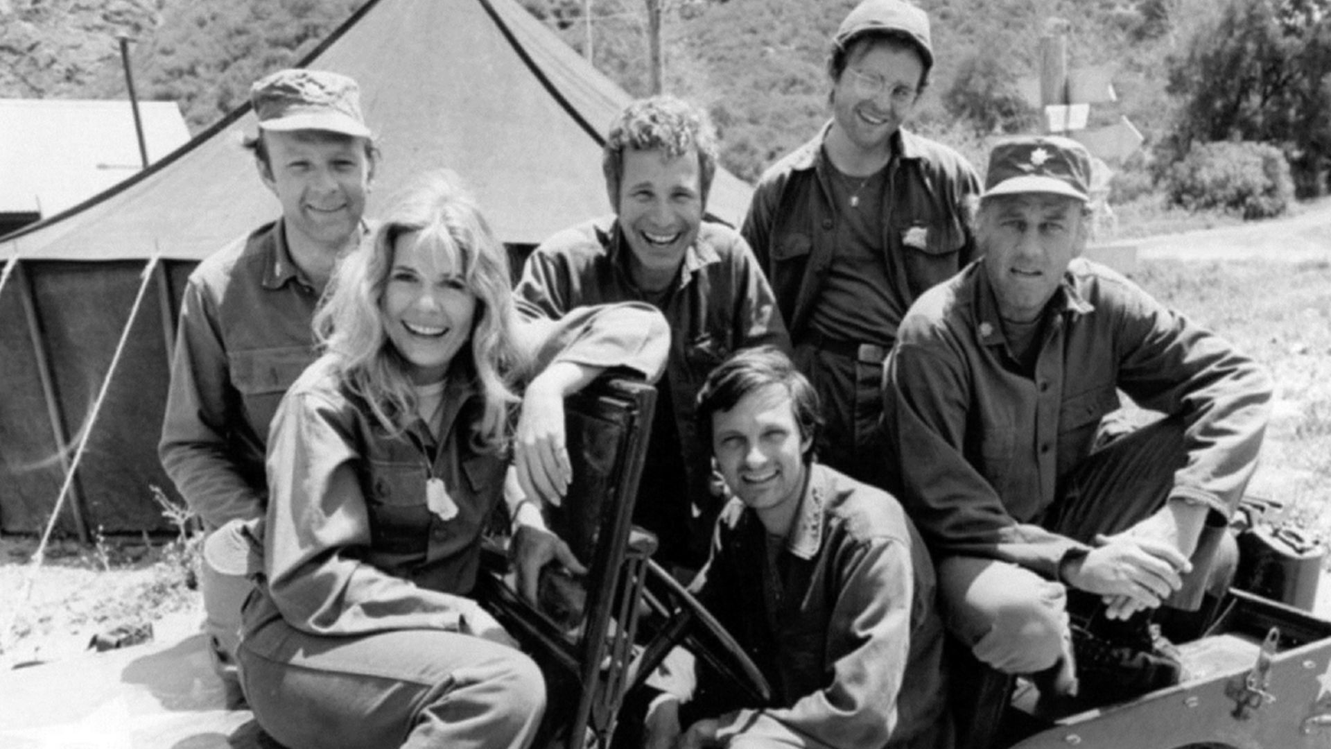 Publicity photo from the M*A*S*H season premiere, 1974. Pictured are: Loretta Swit, Larry Linville, Wayne Rogers, Gary Burghoff, Alan Alda (driver of jeep), and McLean Stevenson.