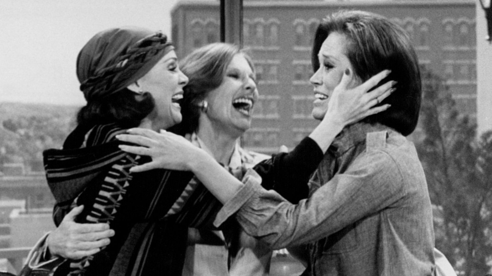 Photo from the last episode of The Mary Tyler Moore Show.  Rhoda Gerard (Valerie Harper, left) and Phyllis Lindstrom (Cloris Leachman, center) come to cheer up Mary Richards (Mary Tyler Moore) after hearing the news that WJM-TV has been sold and that she 