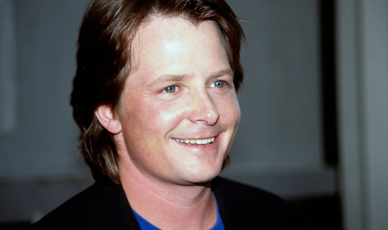 Michael J. Fox, CNN Building, Hollywood Canadian actor Michael J Fox, wearing a black jacket over a blue t-shirt, arrives for the recording of 'Larry King Live,' outside the CNN Building in the Hollywood neighbourhood of Los Angeles, California, 30th July 1991. Fox was promoting his new film, 'Doc Hollywood'.