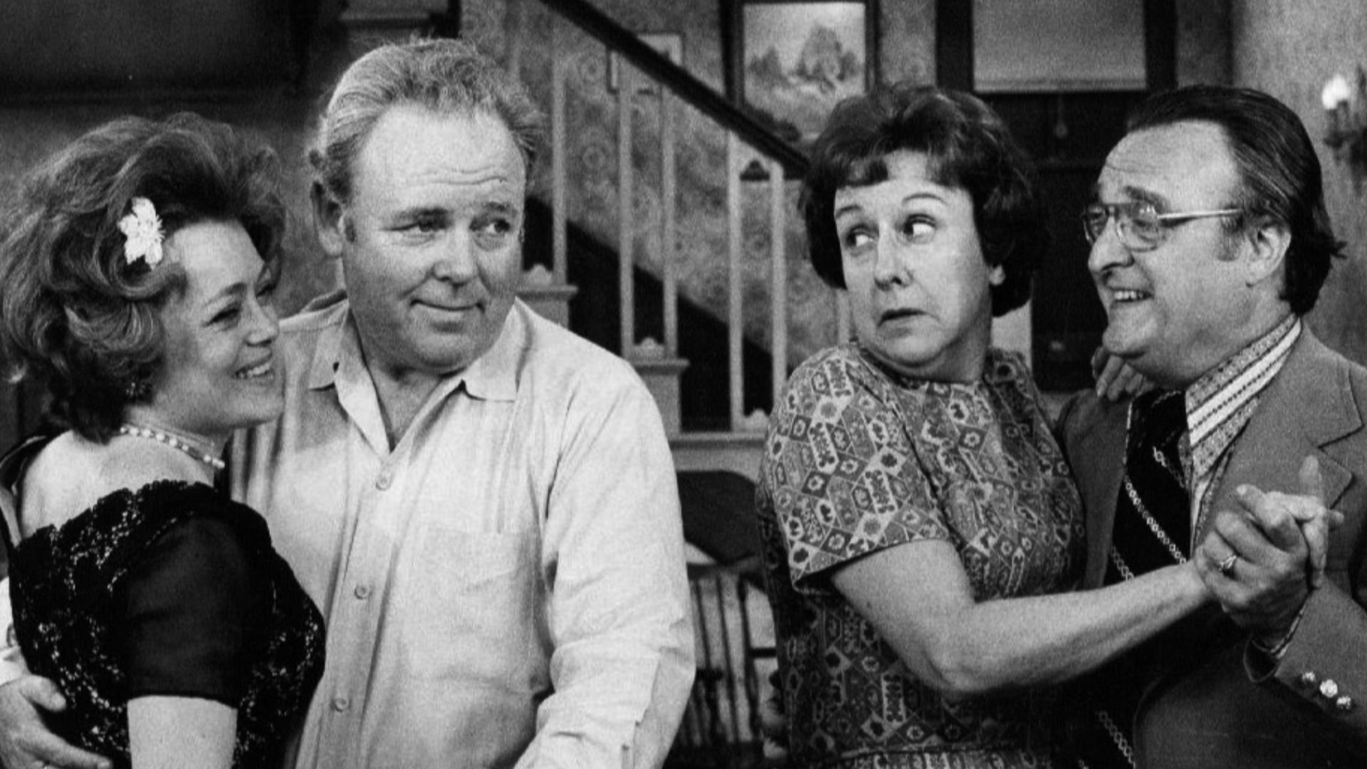 Photo of Rue McClanahan and Vincent Gardenia as Ruth and Curtis Rempley with Carroll O'Connor and Jean Stapleton as Archie and Edith Bunker.  When Edith invites a nice new couple she met to come to the Bunkers for the evening, after switching dancing part