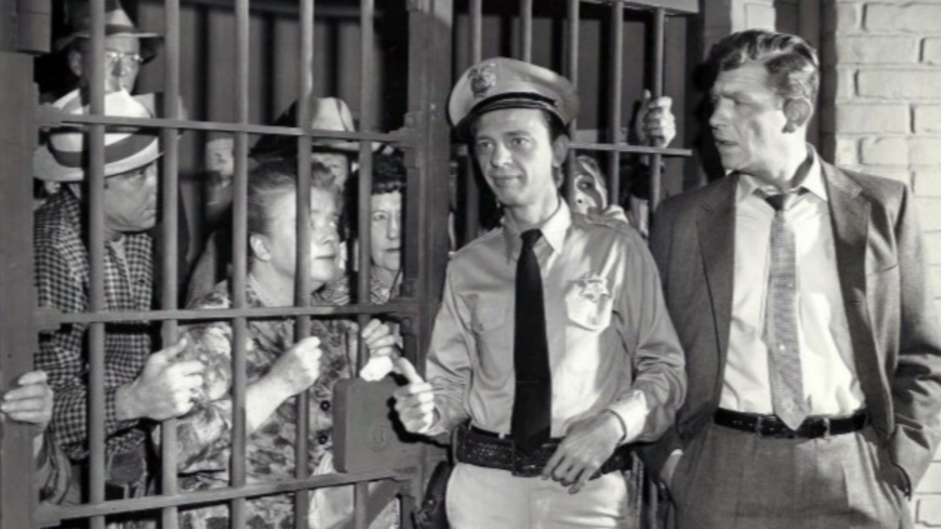 Photo from the television program The Andy Griffith Show.  When Andy returns from a trip, he finds that Barney has managed to put all of Mayberry's citizens behind bars in the town jail.