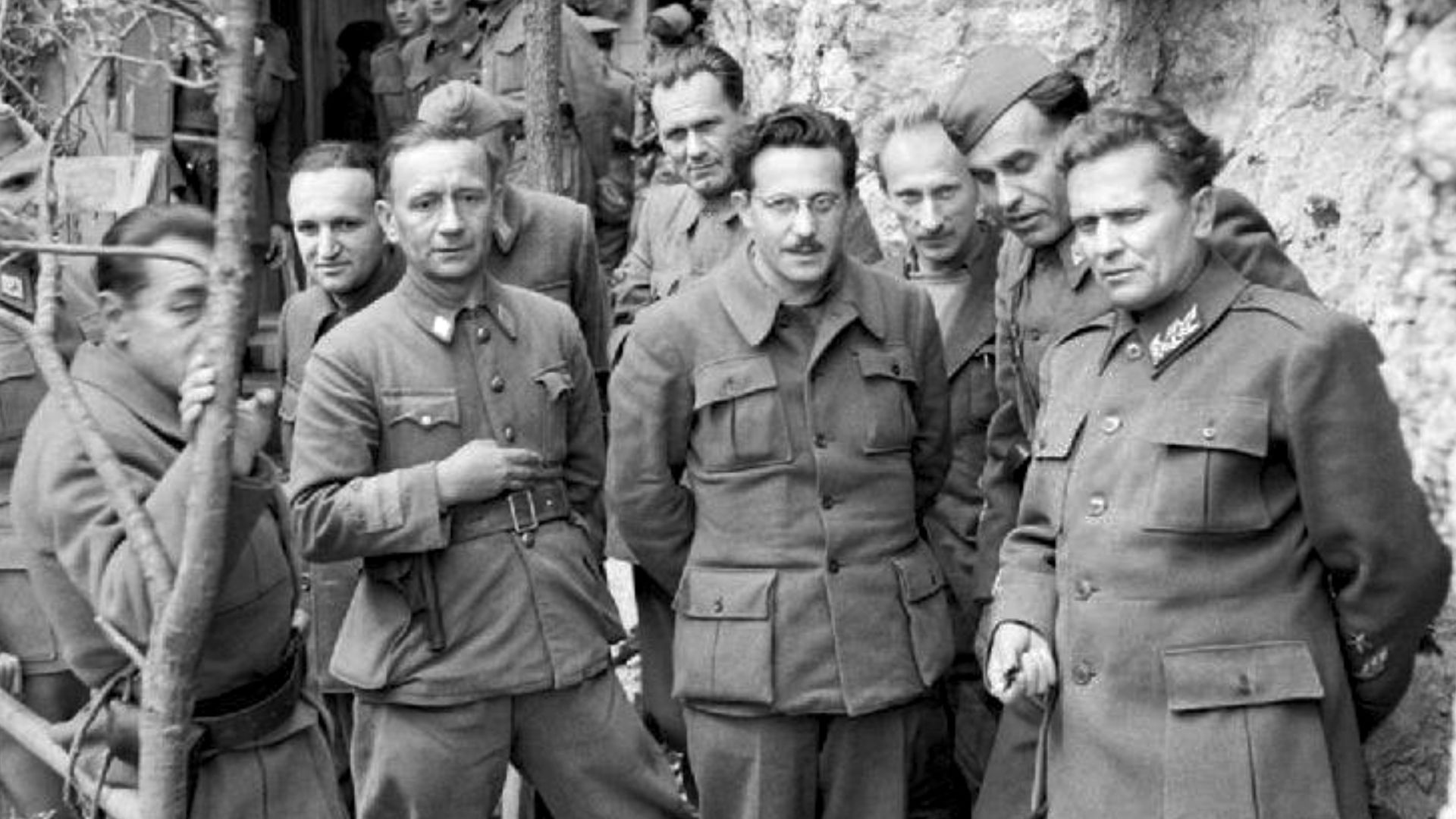 Marshal Tito stands with his Cabinet Ministers and Supreme Staff at his mountain headquarters in Yugoslavia on 14 May 1944. From left to right in the front row are Dr Vladislav S. Ribnikar (Minister of Information), Colonel Sulejman Filipović (Minister of