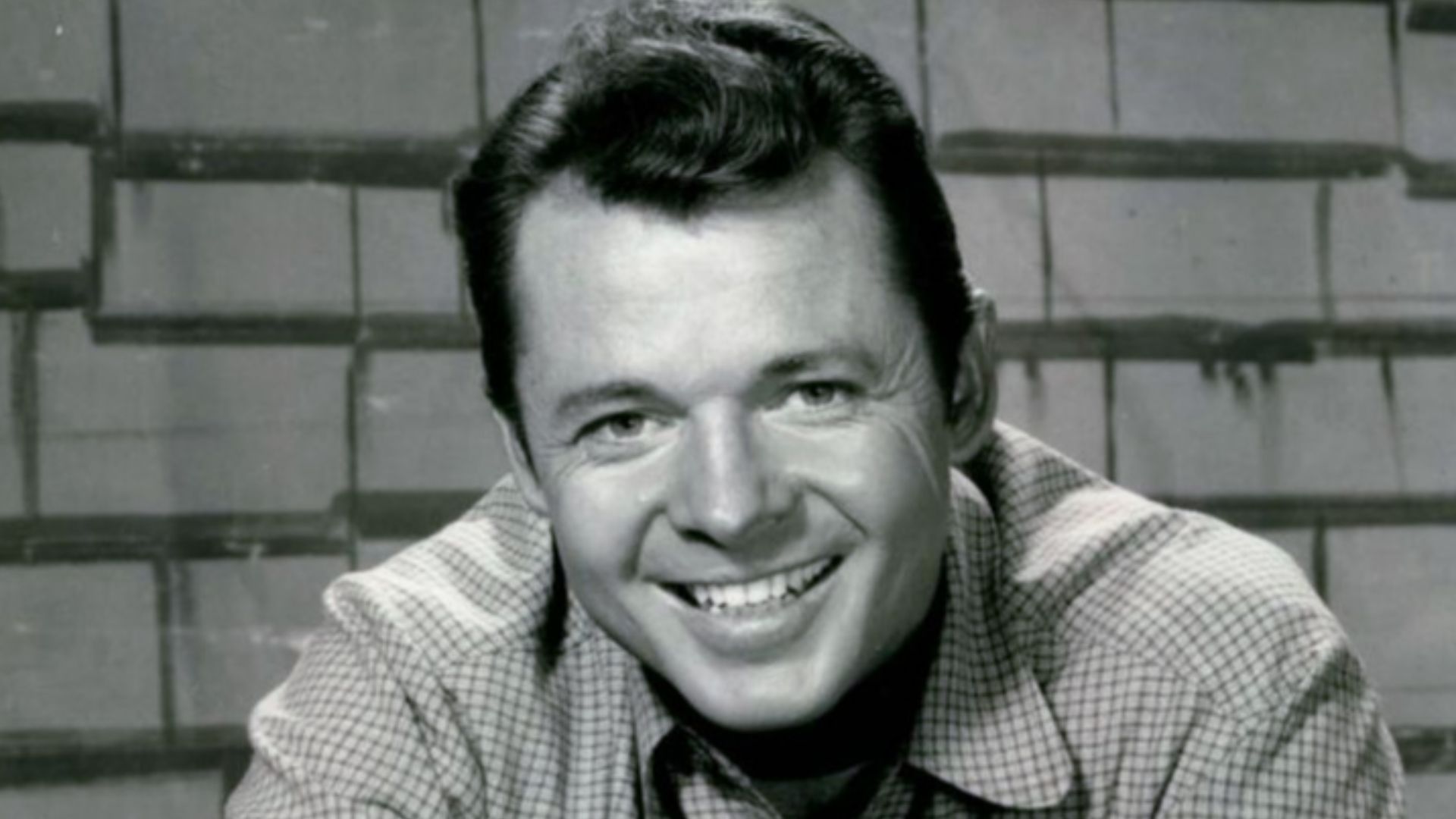 Photo of Audie Murphy as Tom Smith from the television program Whispering Smith.