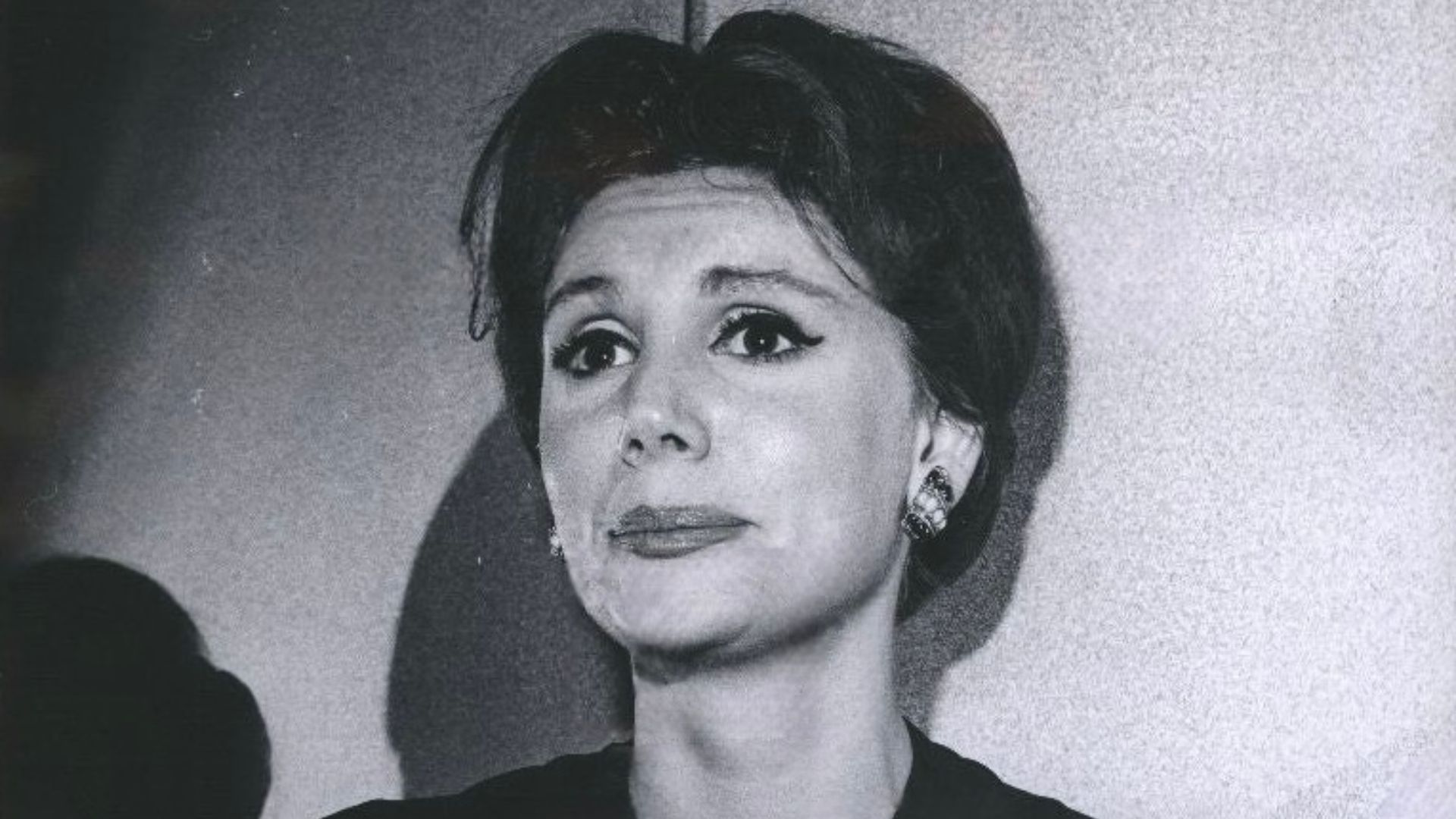 This is a publicity photo, circulated for publicity, of Louise Troy, published in 1966 without copyright notice, qualifying it under public domain.