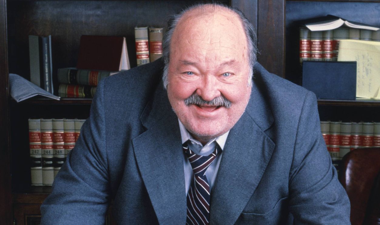 Jake And The Fatman William Conrad (1920-1994), US actor, leaning on a desk on which sits an Englisg bulldog, in a publicity portrait issued for the US television series, 'Jake and the Fatman', circa 1990. The crime drama starred Conrad as 'Jason Lochinvar 'Fatman' McCabe'. 