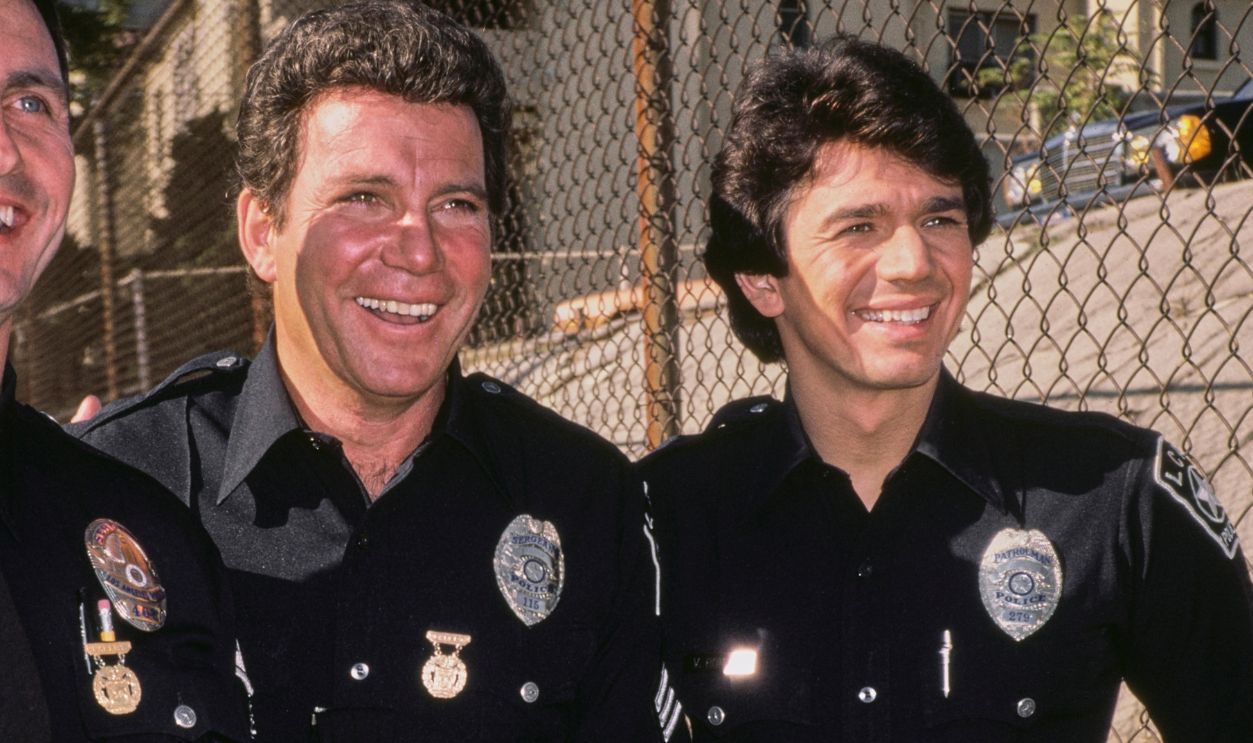 Filming T. J. Hooker Canadian actor William Shatner (centre) and American actor Adrian Zmed (right) on the set of the American drama television series 'T J Hooker', circa 1984.