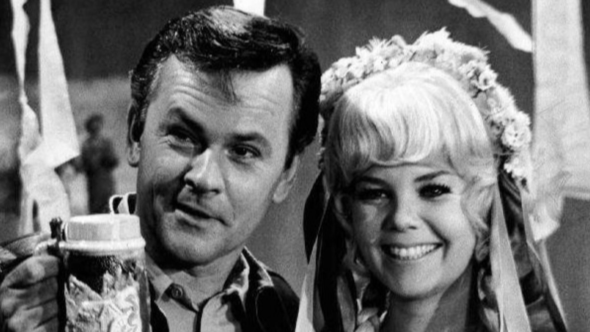 Photo of Bob Crane as Colonel Hogan and Sigrid Valdis as Fräulein Hilda from the television program Hogan's Heroes. Crane and Valdis married about a year after this photo was taken.