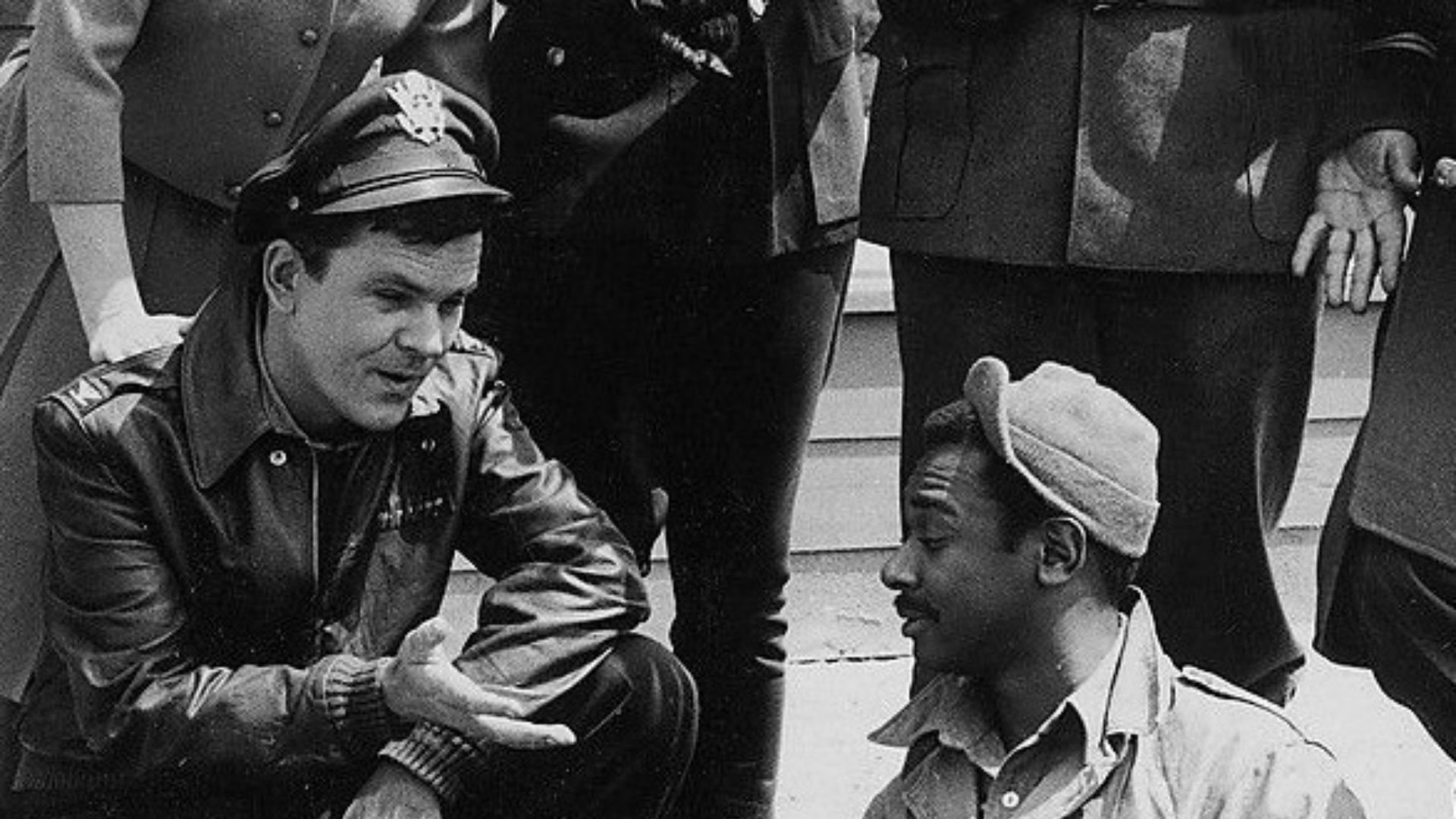 Colonel Hogan (Bob Crane) talking to Sergeant Kinchloe (Ivan Dixon)
This is a cropped image of Hogan's Heroes main cast 1965.jpg which was originally posted on the local site.