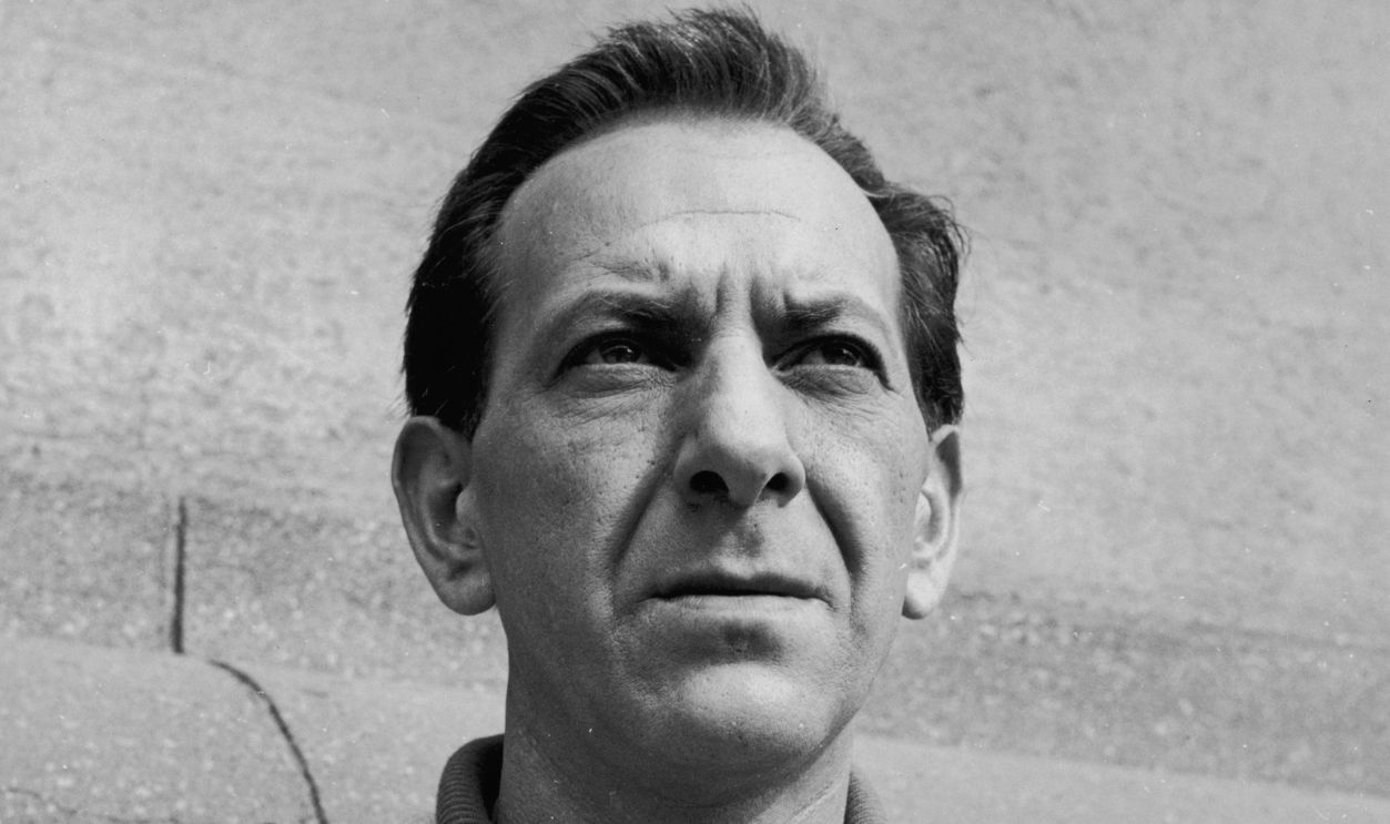 Getty Images - 3206582 - American actor Jack Klugman stands in front of a wall with his arms folded in a promotional portrait for the television series, 'Harris Against the World'. He wears a cardigan sweater and a polo shirt.