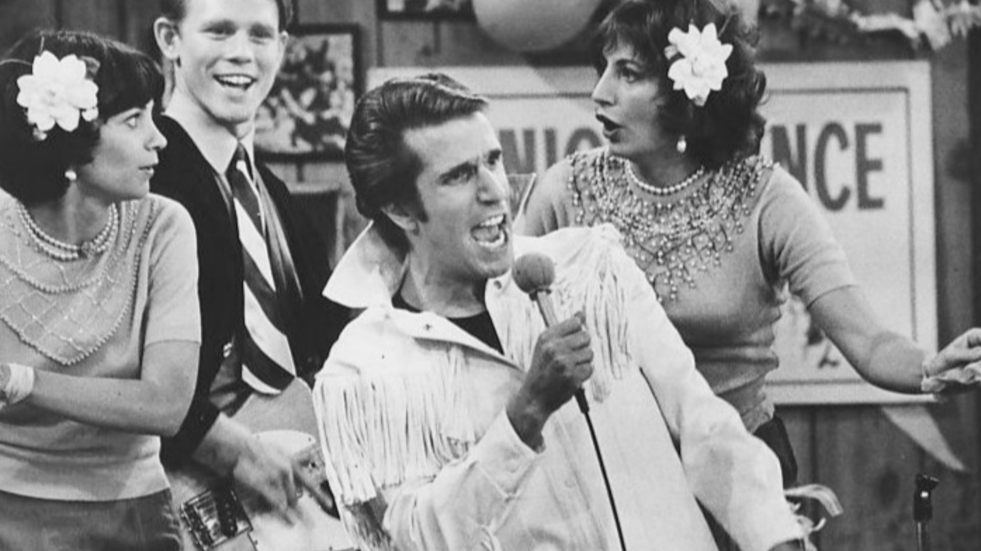 Photo from Happy Days.  In this episode, The Fonz becomes a singing superstar.  Pictured are Cindy Williams as Shirley Feeney, Ron Howard as Richie Cunningham, Henry Winkler as Fonzie and Penny Marshall as Laverne DiFazio.