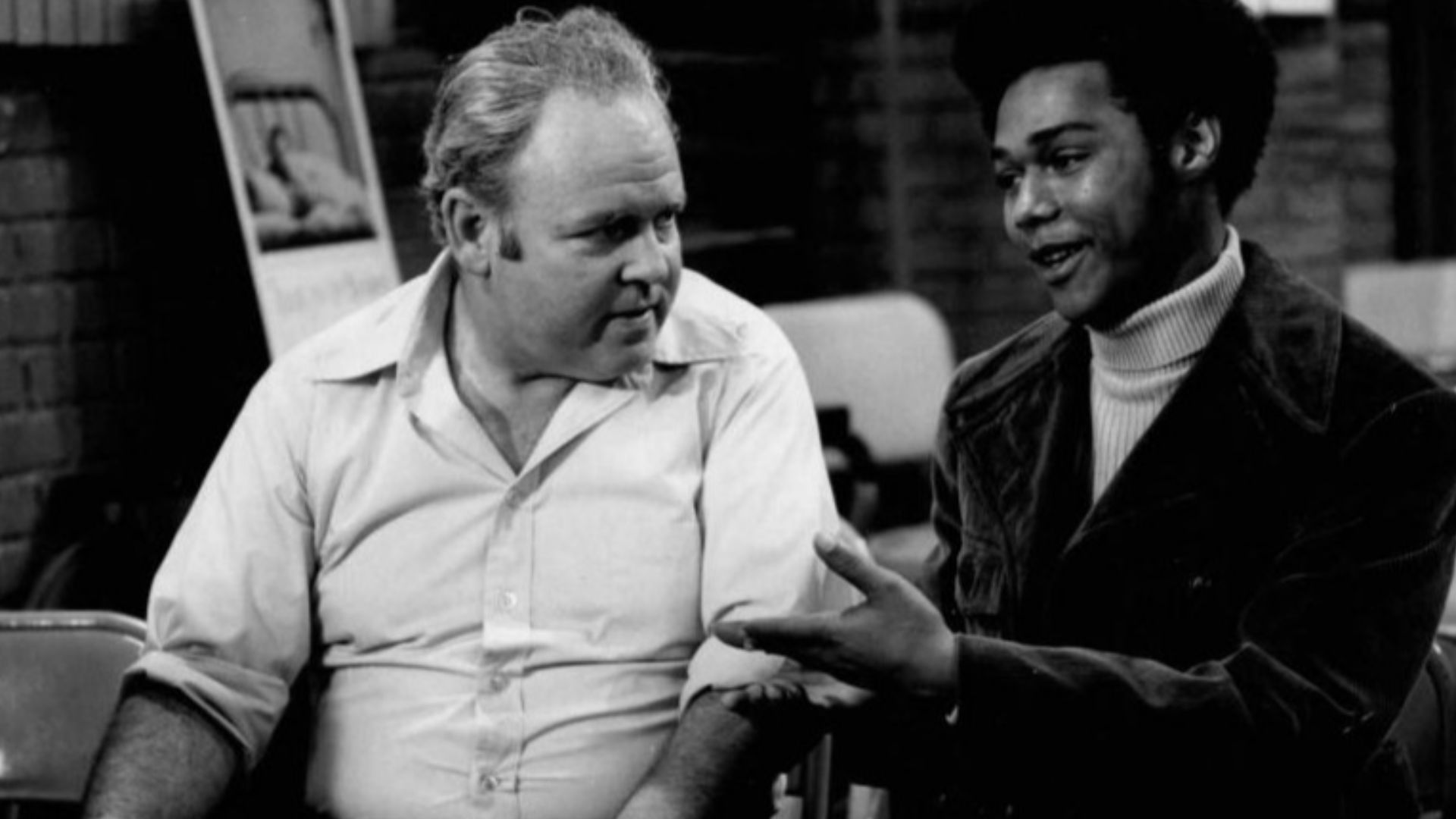 Publicity photo from the television program All in the Family.  Pictured are Carroll O'Connor (Archie Bunker) and Michael Evans (Lionel Jefferson).  In this episode, Archie visits a local blood bank to donate and meets his neighbor, Lionel Jefferson, who 
