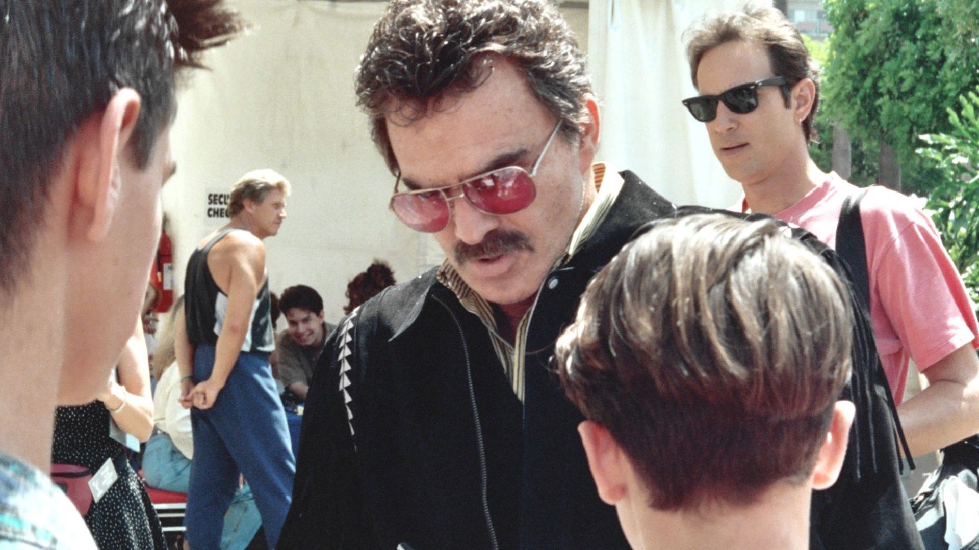 Burt Reynolds signing autographs at the 1992 Emmy Awards