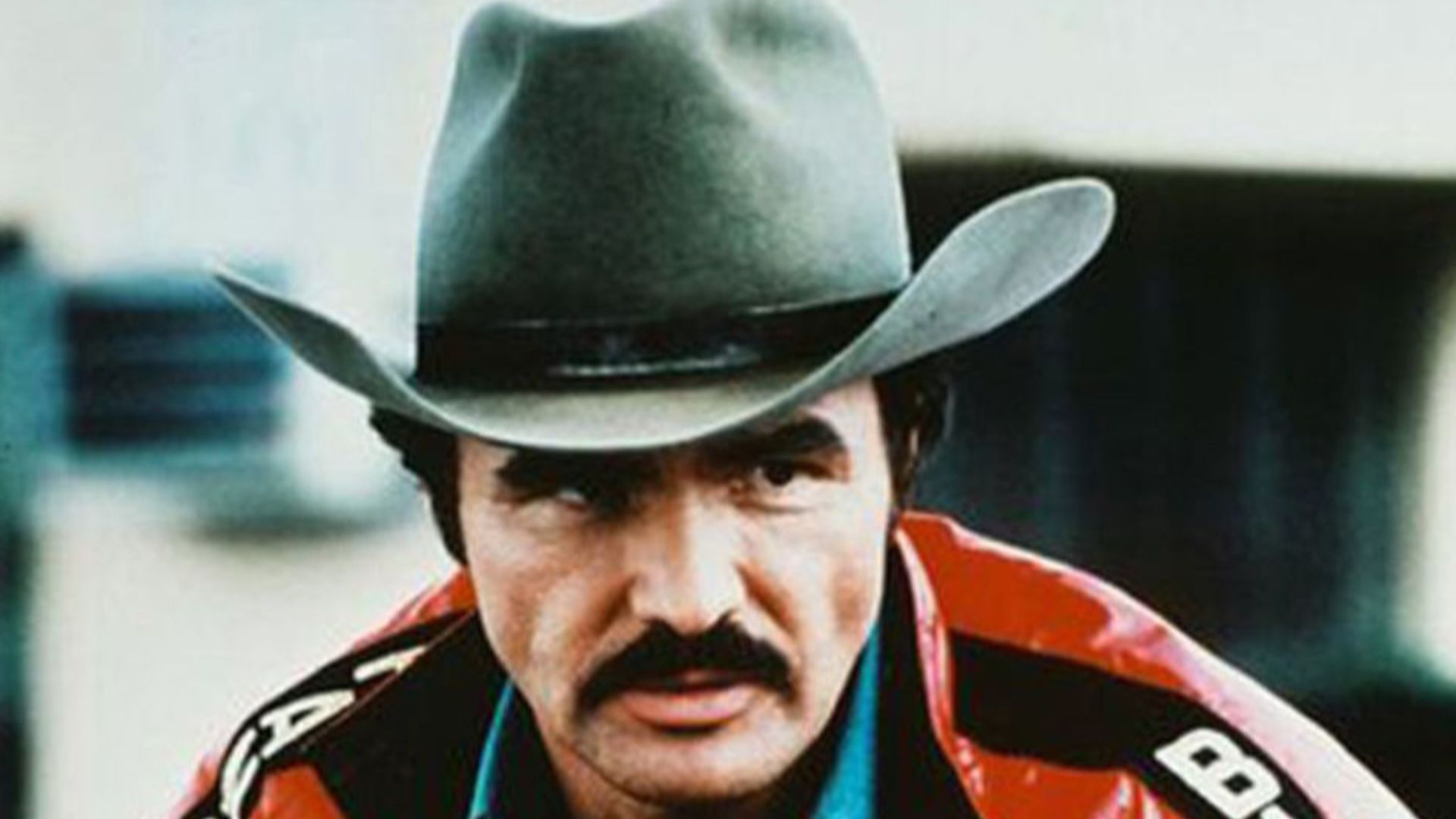 The red Smokey and the Bandit jacket used in the film Smokey and the Bandit 2, starring Burt Reynolds, was designed and manufactured by Jim Watkins in 1977 for Burt Reynolds in Los Angeles, California. watkinssportswear.com is an LA-based company founded 