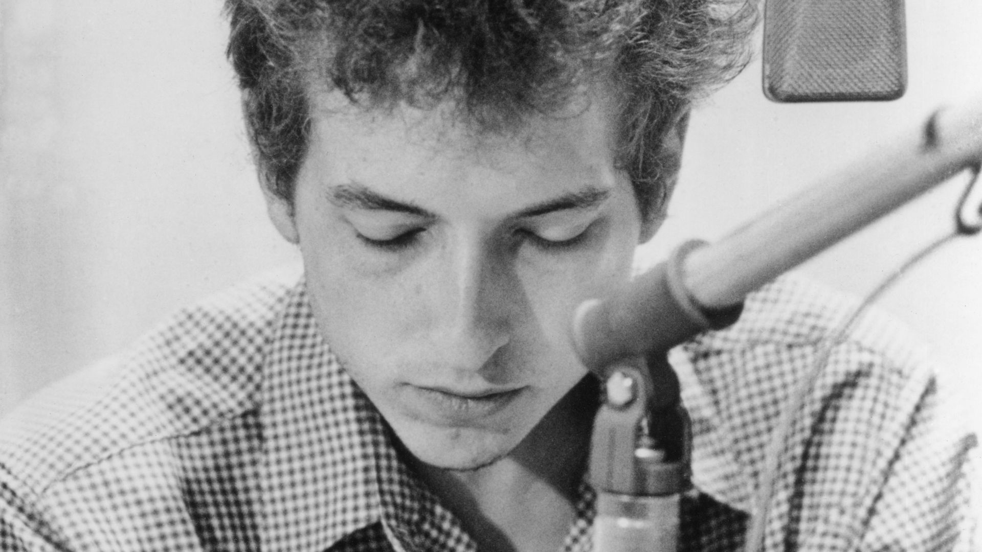 Bob Dylan, 1963 promo photo by Don Hunstein for The Times They Are a-Changin' in a recording studio.