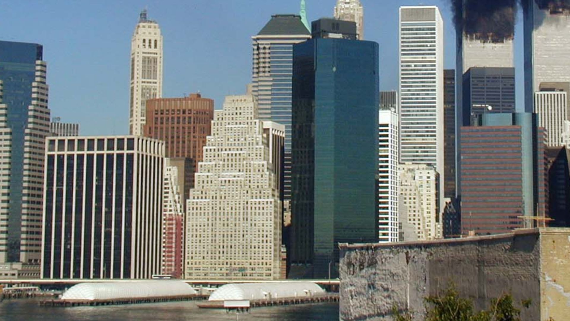 Plumes of smoke billow from the World Trade Center towers in Lower Manhattan, New York City, after a Boeing 767 hits each tower during the September 11 attacks.