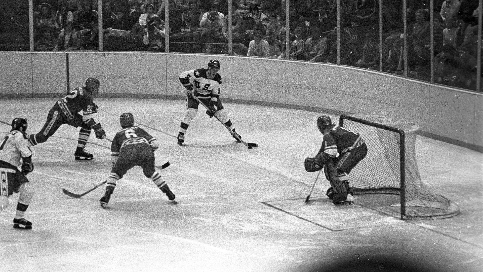 USA - Soviet Union match, Winter Olympics 1980. Mike Ramsey #5 with the puck, #22 Viktor Zhluktov; #6 Valeri Vasiliev