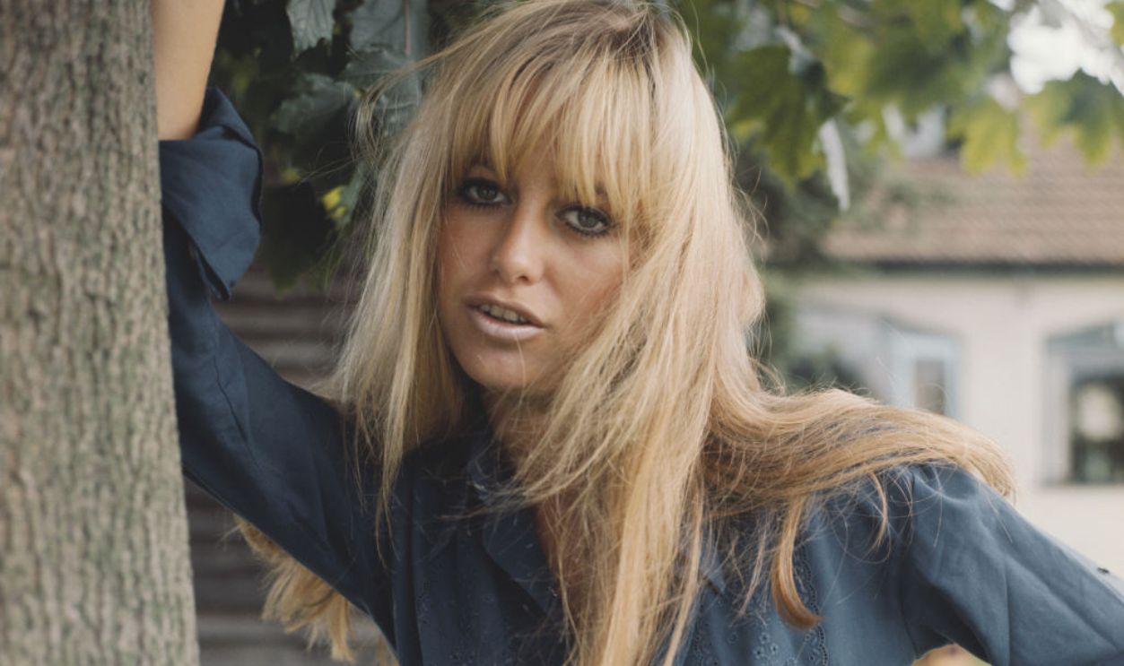 Susan George English actress Susan George posed wearing a blue blouse in England in 1972.