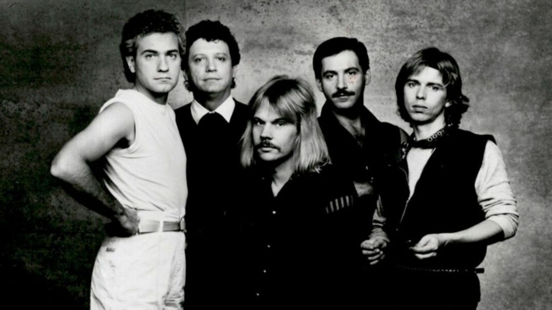 Muscial group Styx, in a 1983 publicity photo. Pictured from left to right; Dennis De Young, John Panozzo, James Young, Chuck Panozzo, and Tommy Shaw.
