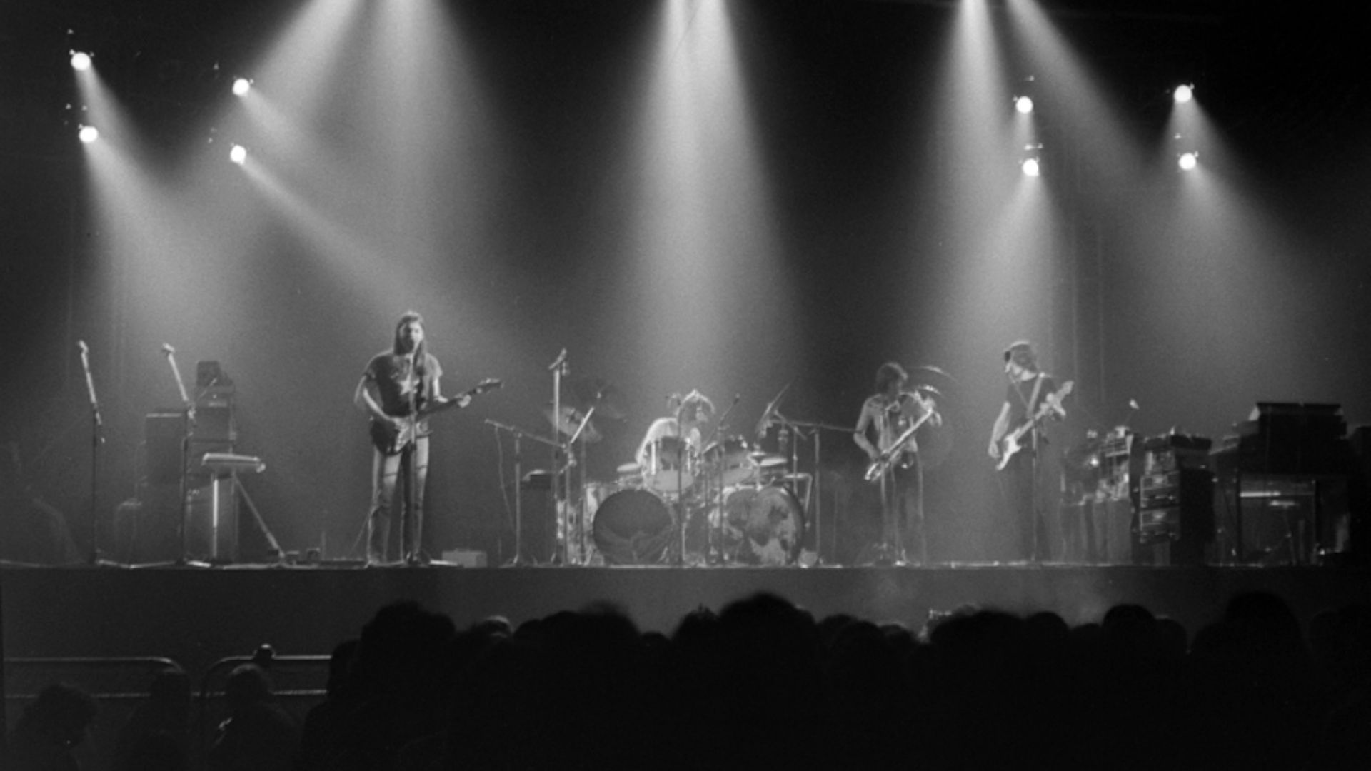 A live performance of The Dark Side of the Moon at Earls Court, shortly after its release in 1973: (l-r) Gilmour, Mason, Dick Parry, Waters