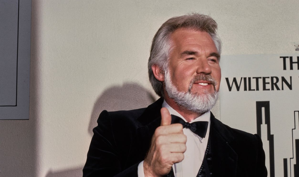 American singer-songwriter Kenny Rogers attends the 4th Annual American Video Awards at the Wiltern Theater in Los Angeles, California, 20th November 1985.